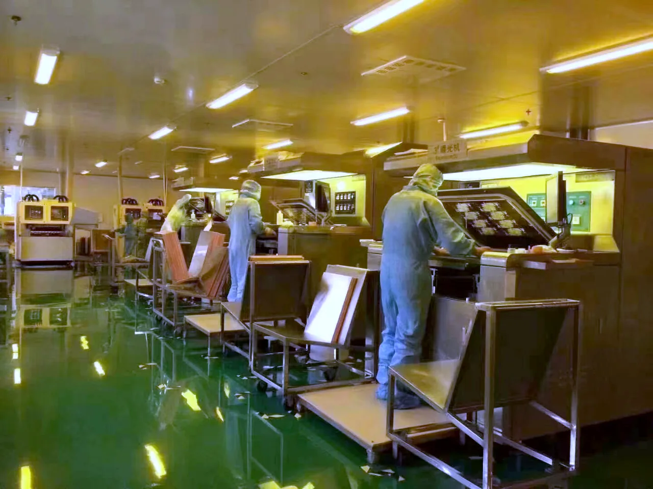 Operators inspecting assembled PCBA