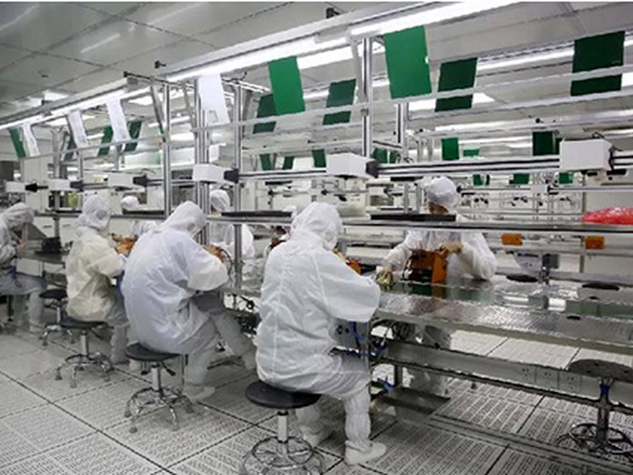Operators assembling boards in a clean workshop